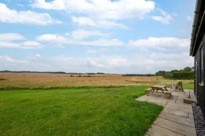 a picnic table in the middle of a field at 1 Bed in Wickhambrook oc-tosh in Wickhambrook