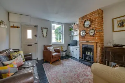 a living room with a couch and a fireplace at 1 Bed in Woodbridge oc-jsm in Woodbridge