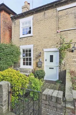 a brick house with a white door and a window at 1 Bed in Woodbridge oc-jsm in Woodbridge