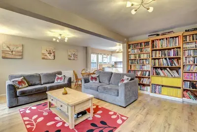 a living room with two couches and bookshelves at 1 Bed in Sibton oc-sfbor in Sibton