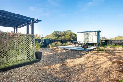 a backyard with a bench and a fence at 1 Bed in Sibton oc-sfbor in Sibton