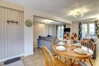 a dining room and living room with a table and chairs at 1 Bed in Sibton oc-sfbor in Sibton