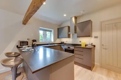 a large kitchen with a counter top and a kitchen island at 1 Bed in Middleton oc-stbc in Middleton