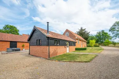 a brick house with a black roof at 1 Bed in Halesworth oc-bbb in Bramfield