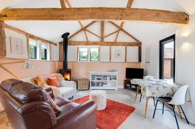 a living room with a couch and a table at 1 Bed in Halesworth oc-bbb in Bramfield