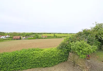 a field next to a field with a tree at 1 Bed in Wickham Market oc-samp in Wickham Market