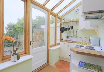 a kitchen with a window and a stove top oven at 1 Bed in Wickham Market oc-samp in Wickham Market