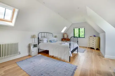 a white bedroom with a bed and a window at 1 Bed in Sudbourne oc-tgs in Sudbourne