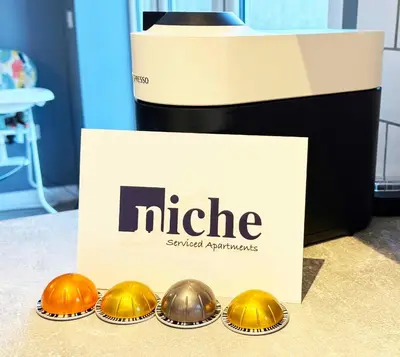 four gold helmets in muffins in front of a box at Niche Parkview Apartments in Brentwood