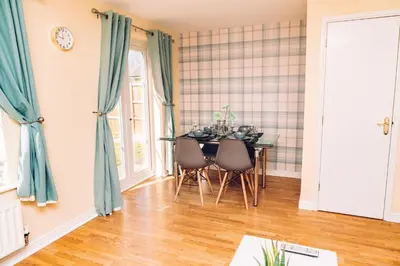 a dining room with a table and chairs at Comfortable Colchester Home in Colchester
