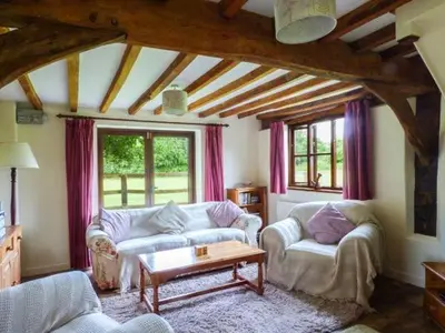 a living room with two couches and a coffee table at The Granary in Norwich
