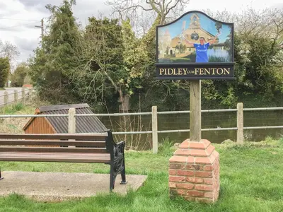 a sign for a park with a bench next to a fence at Deer Lodge - Ukc4325 in Pidley