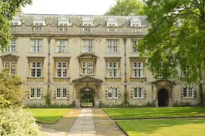 an old mansion with a lawn in front of it at Christ's College Cambridge in Cambridge