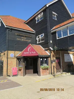 a building with a hotel and pub on a street at Oyster Fleet Hotel in Canvey Island