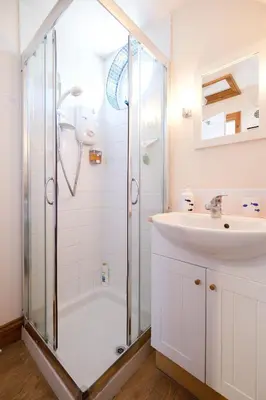 a bathroom with a shower and a sink at The Bay Tree Studio in Thorpeness