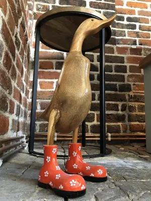 a statue of a duck with red rubber boots at Millie's Cottage in Finchingfield