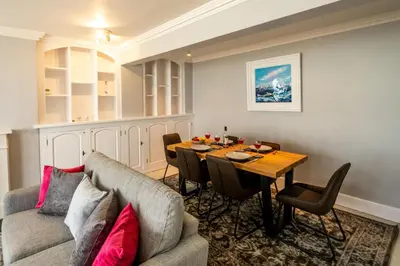 a living room with a couch and a table at Crags Nest in Aldeburgh