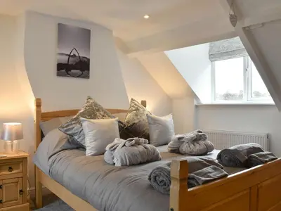 a bedroom with a bed with towels on it at Hidden Gem in Willingham