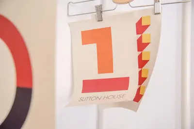 a sign for a sunbury house hanging on a door at Sutton House, Woodbridge in Woodbridge
