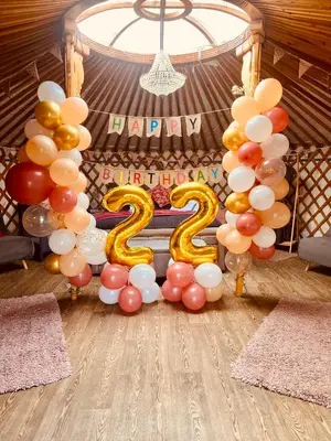 a balloon arch with a number two sign and balloons at Glamp and Tipple Ltd in Great Ellingham