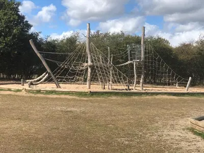 a playground with a net in a park at Excellent caravan 2 bedrooms sleeps 6 in East Mersea