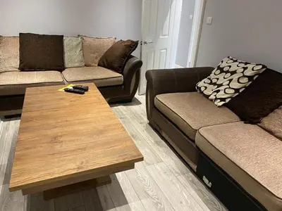 a living room with a couch and a coffee table at Breeze on Southend in Essex in Southend-on-Sea