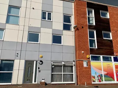 a brick building with a door in front of it at Toothbrush Apartments - Central Ipswich - Nr Train Station in Ipswich