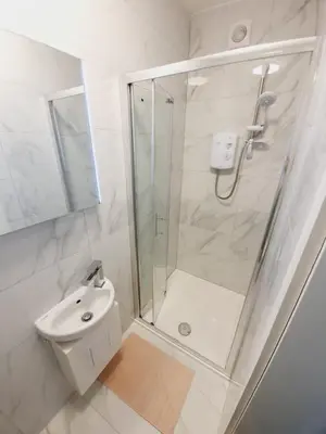 a bathroom with a shower and a toilet and a sink at Southend on Sea - Westcliff Studios - Great Location in Southend-on-Sea