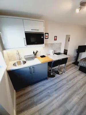 a kitchen with a sink and a counter top at Southend on Sea - Westcliff Studios - Great Location in Southend-on-Sea