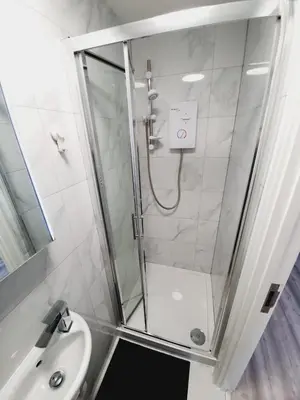 a bathroom with a shower and a sink at Southend on Sea - Westcliff Studios - Great Location in Southend-on-Sea