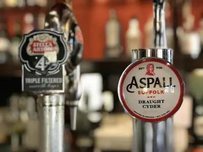 a sign for a bar with aasyril supply and a draught order at The White Horse in Beyton