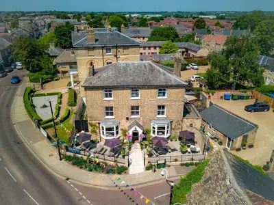 an aerial view of a large brick house on a street at The Bramley House Hotel in Chatteris