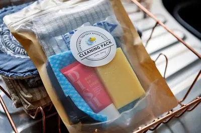 a bag of cleaning picks sitting on a rack at Finest Retreats - The Stables at Crimplesham in Stradsett