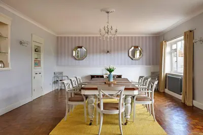 a dining room with a table and chairs at Finest Retreats - The Stables at Crimplesham in Stradsett