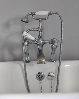 a chrome bathtub faucet with a toothbrush at Finest Retreats - The Stables at Crimplesham in Stradsett