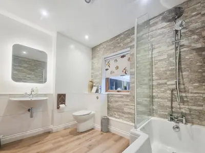a bathroom with a toilet and a sink and a shower at Mac Shack Cottage - Uk32376 in Ovington