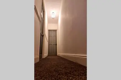 an empty hallway with a door and a room at Berrygate in Ipswich