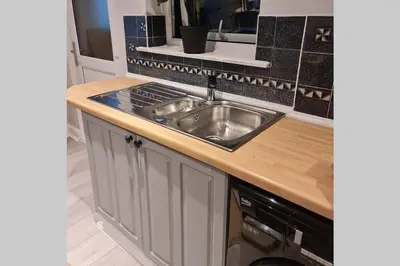 a kitchen with a sink and a counter top at Berrygate in Ipswich