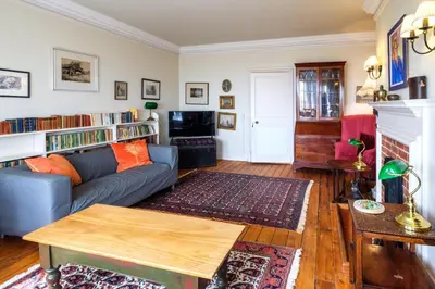 a living room with a couch and a table at Beach House - Aldeburgh Coastal Cottages in Aldeburgh