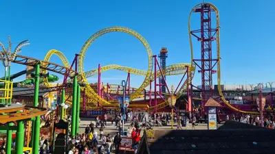 a roller coaster at an amusement park with people at Station Heights in Rayleigh