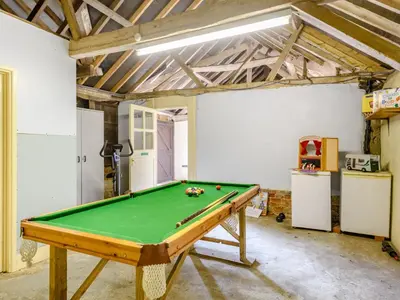 a room with a pool table in it at Coach House - Uk33307 in Mellis
