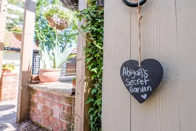 a heart sign on the side of a wall at Abigail's Cottage, Wickham Market in Woodbridge