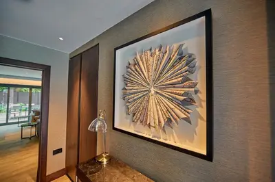 a picture on the wall of a room with a lamp at The Fellows House Mews in Cambridge