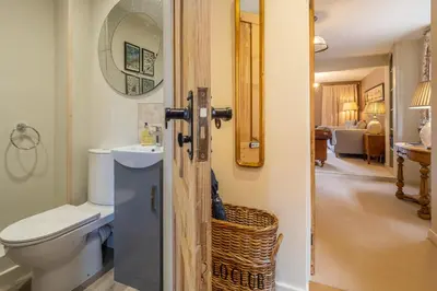 a bathroom with a toilet and a sink at Immaculate luxury retreat in pretty village with great pubs - Box Valley Cottage in Stoke by Nayland