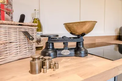 a mortar and pestle sitting on top of a kitchen counter at The Wash House, Middleton in Saxmundham