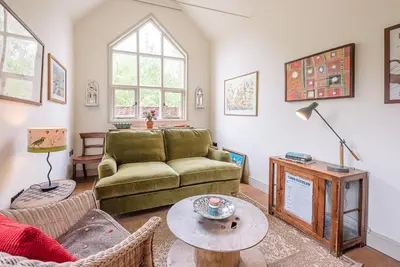 a living room with a couch and a table at The Wash House, Middleton in Saxmundham
