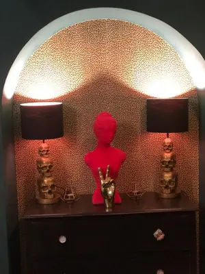 a red doll sitting on a dresser with two lamps at Comfortable Room or Whole House - 4BR 1BATH 1TOILET at Suffolk Pink House, Newmarket in Newmarket