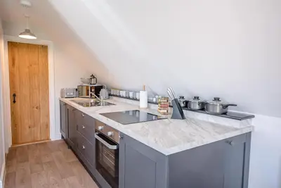 a kitchen with a sink and a counter top at Geoff's Rest at Pond Hall Farm in Hadleigh with Private Hot Tub in Ipswich