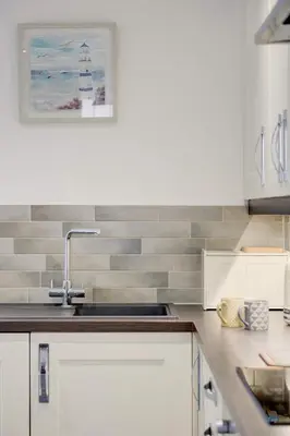 a kitchen with a sink and a counter top at Juniper House in Harwich