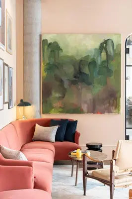 a living room with a red couch and a painting at Hyatt Centric Cambridge in Cambridge